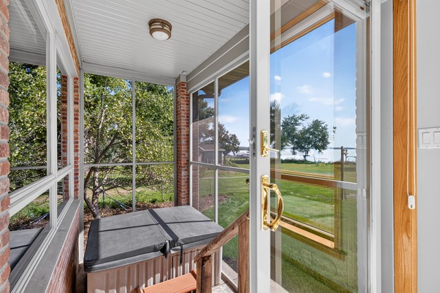 Screened porch with hot tub